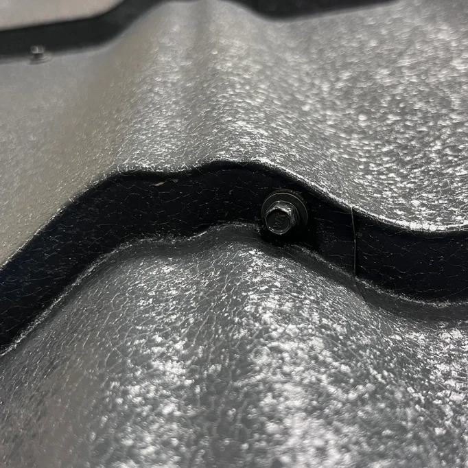 Where do you curl your screws when metal roof?